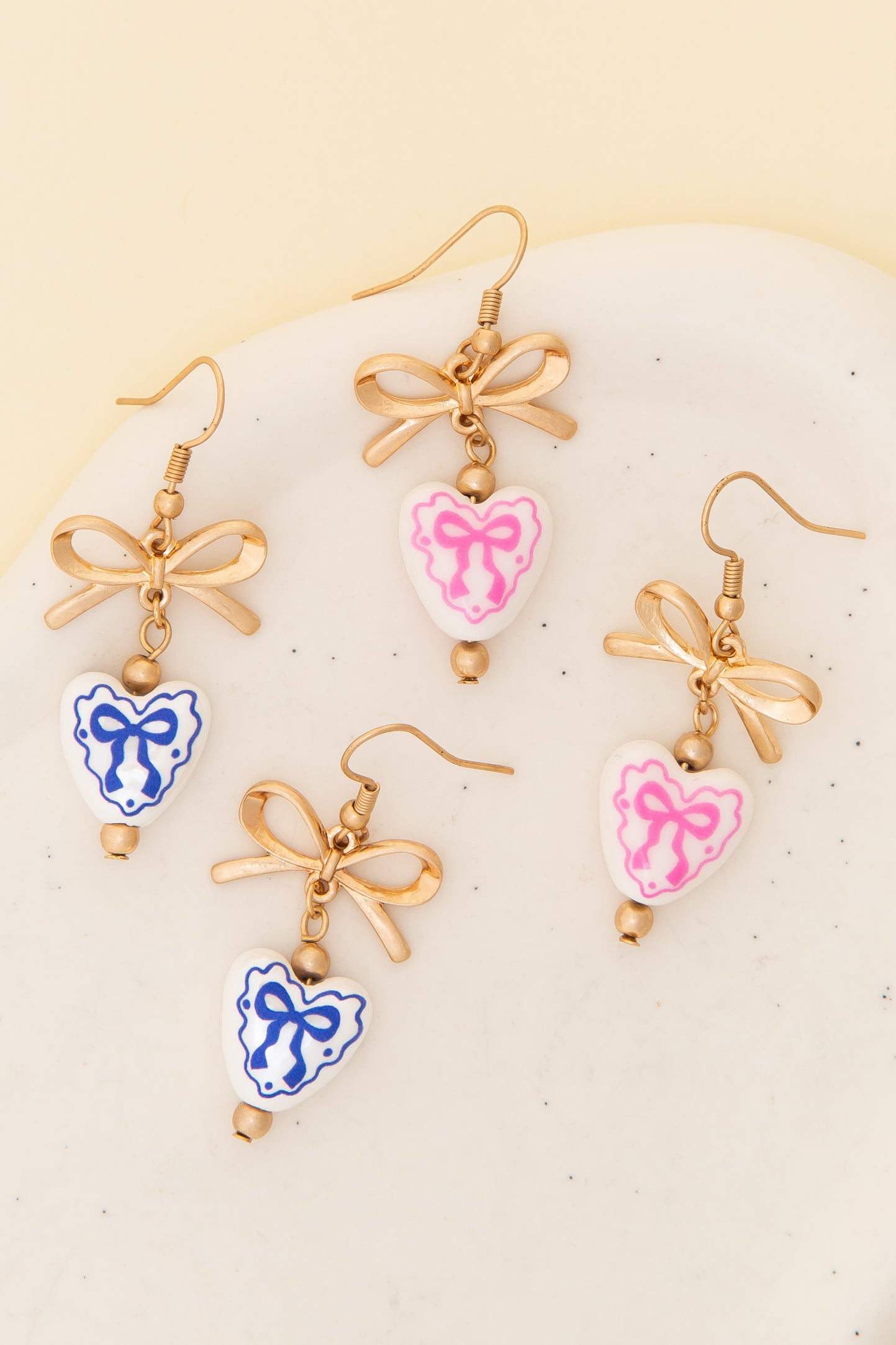 Lilith Ceramic Heart Charm Dangle Earrings with Bow Accent