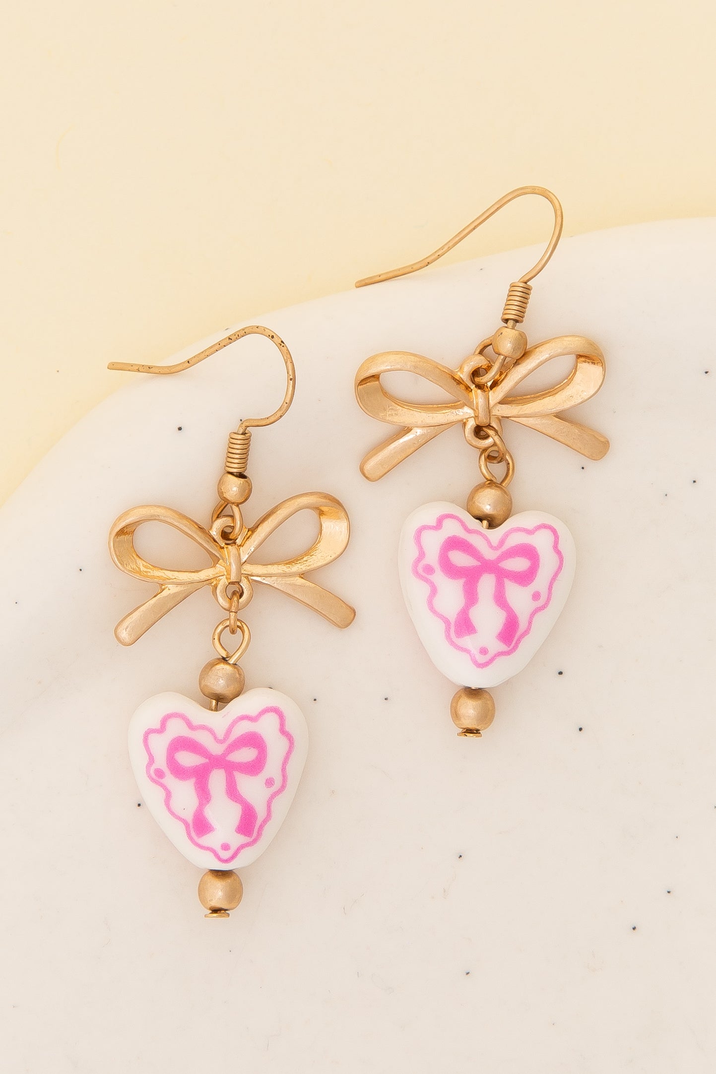 Lilith Ceramic Heart Charm Dangle Earrings with Bow Accent | Pink