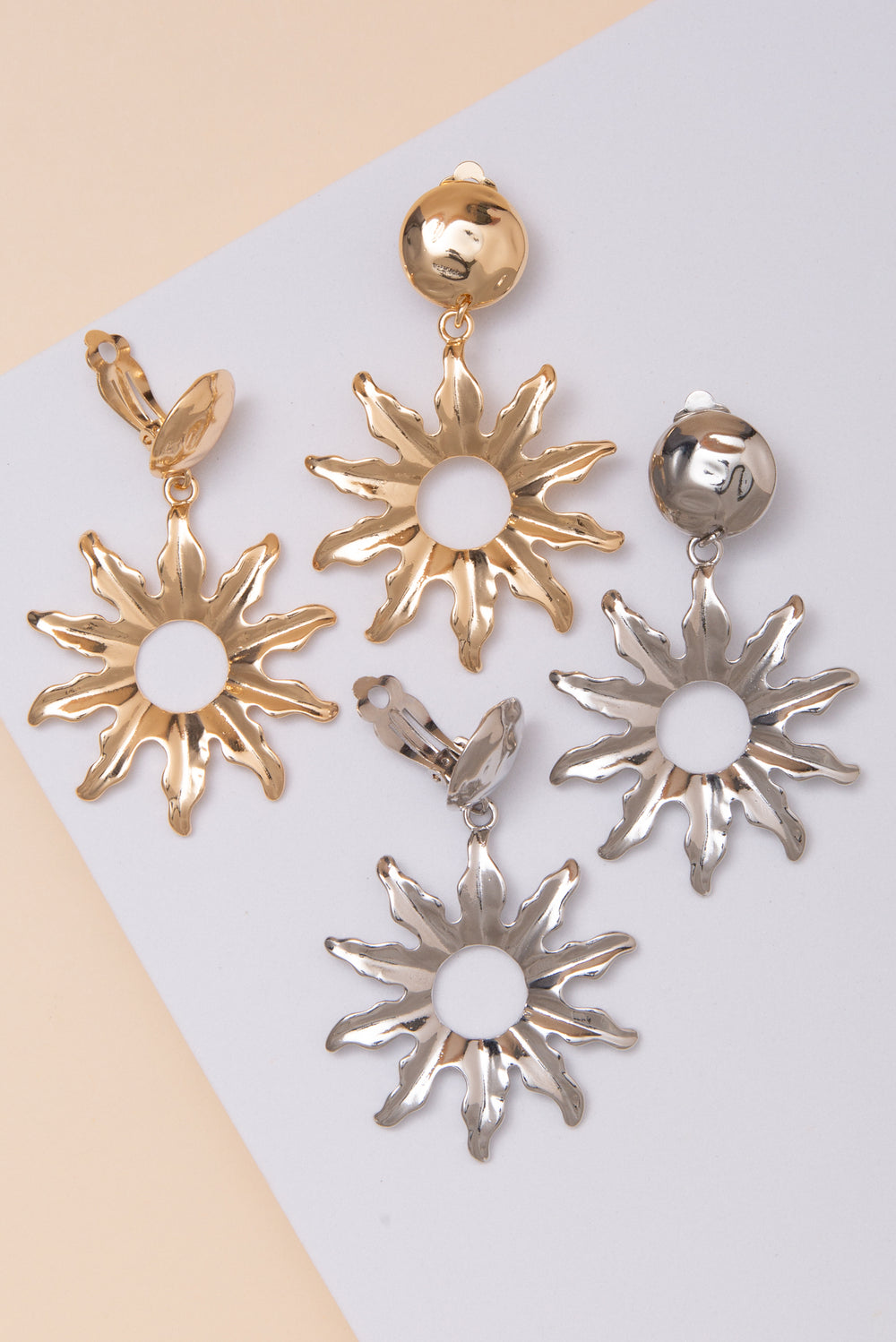 Rebecca Clip On Earrings with Metal Sunburst Cutout Drop