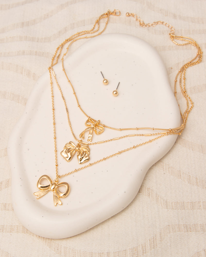 Kara Multi-Strand Bow Pendant Chain Necklace Stud Earring Set