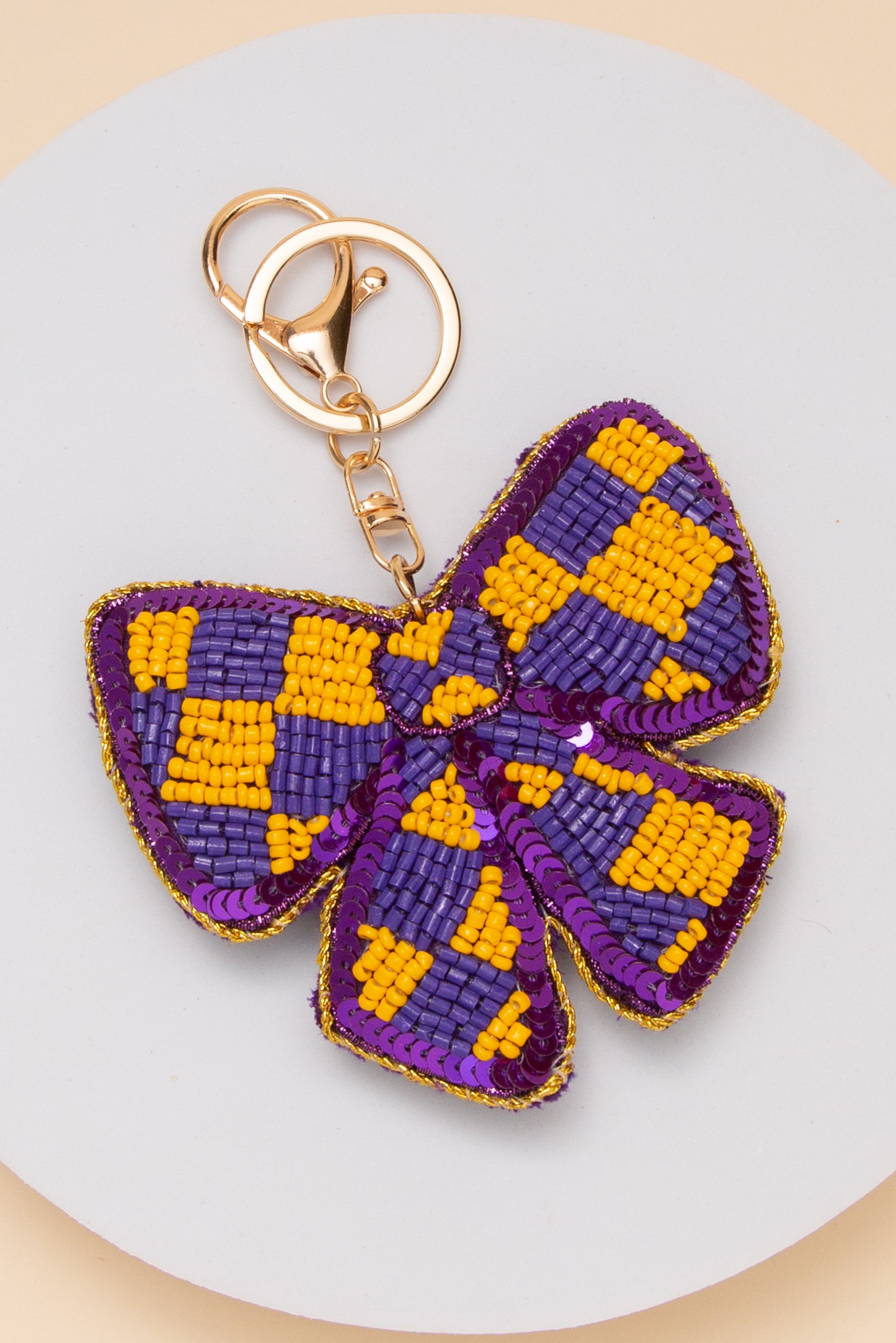 Alora Gameday Checker Pattern Bow Keychain | Purple Yellow