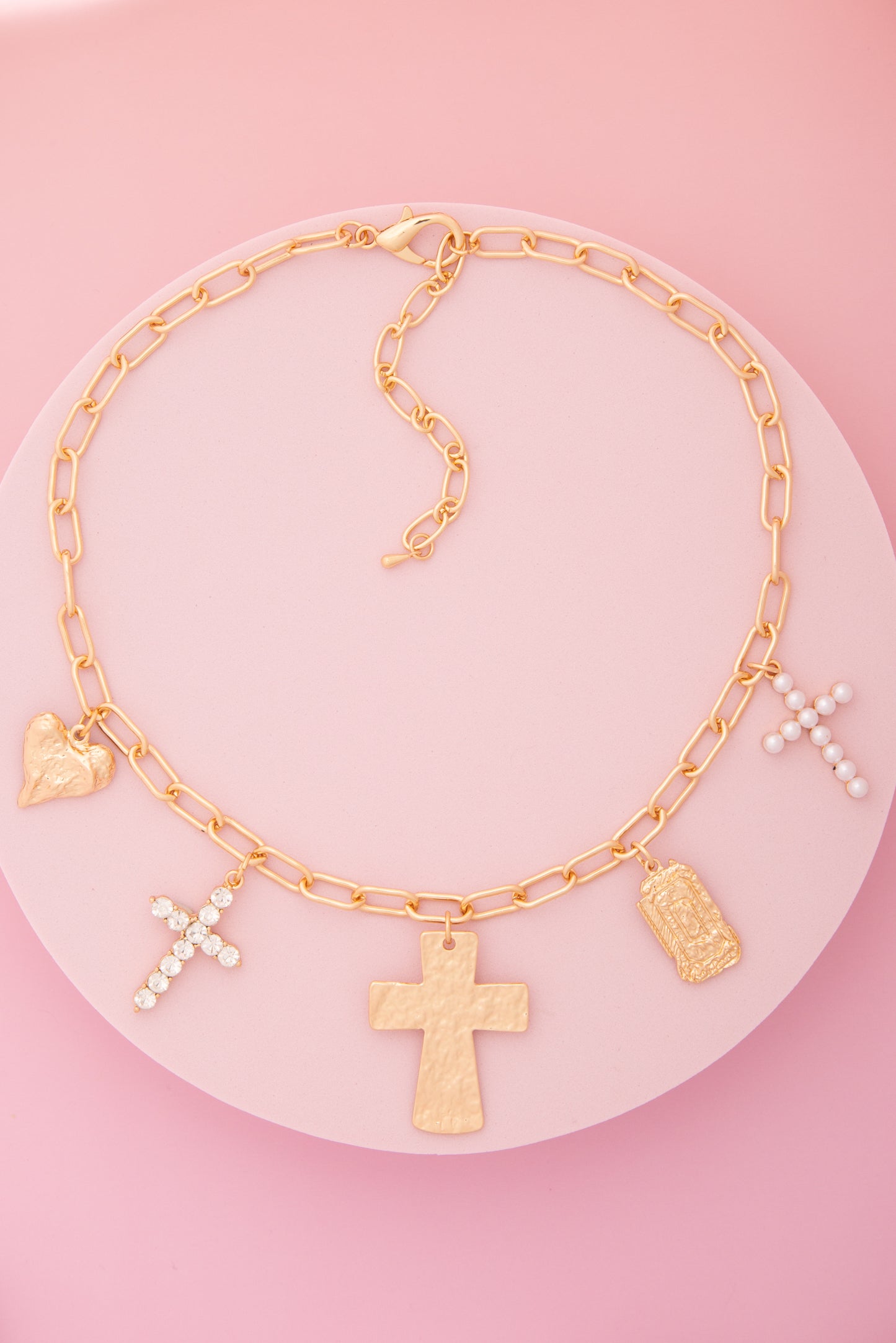 Monica  Charm Necklace Featuring Pearl, Crystal, and Cross Trinkets